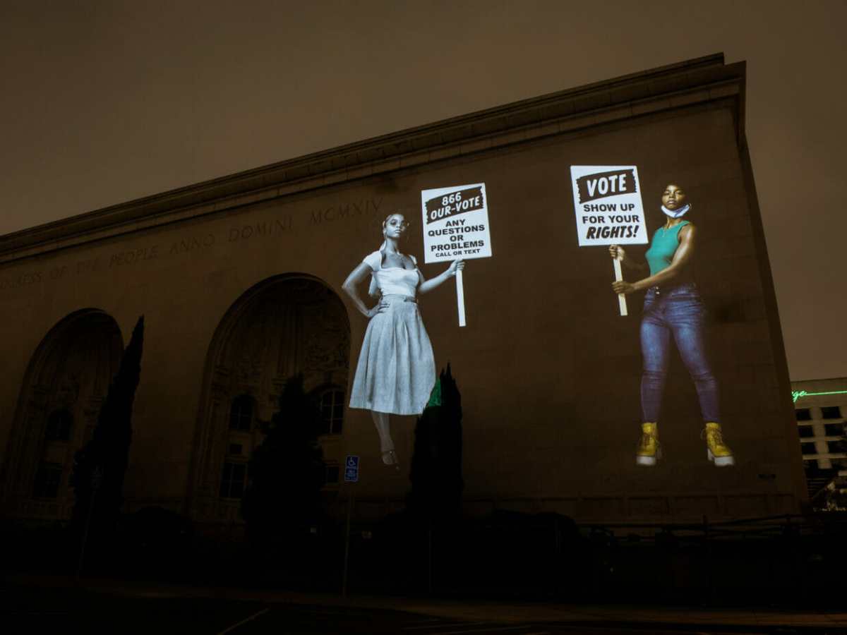 Oakland artists are projecting huge animated murals around town to help voters find ballot boxes
