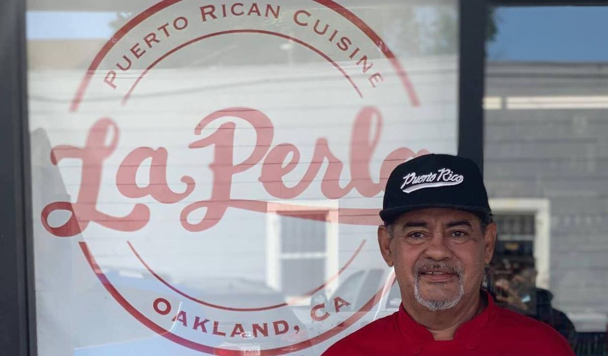 Chef Jose "Chem" Ortiz standing in front of the new, soon to be opened location of La Perla in Oakland's Dimond district.