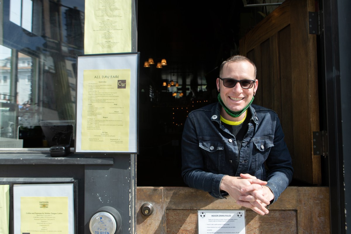 Josh Rosenberg, owner of Commonwealth hangs out of the bar located on Telegraph.