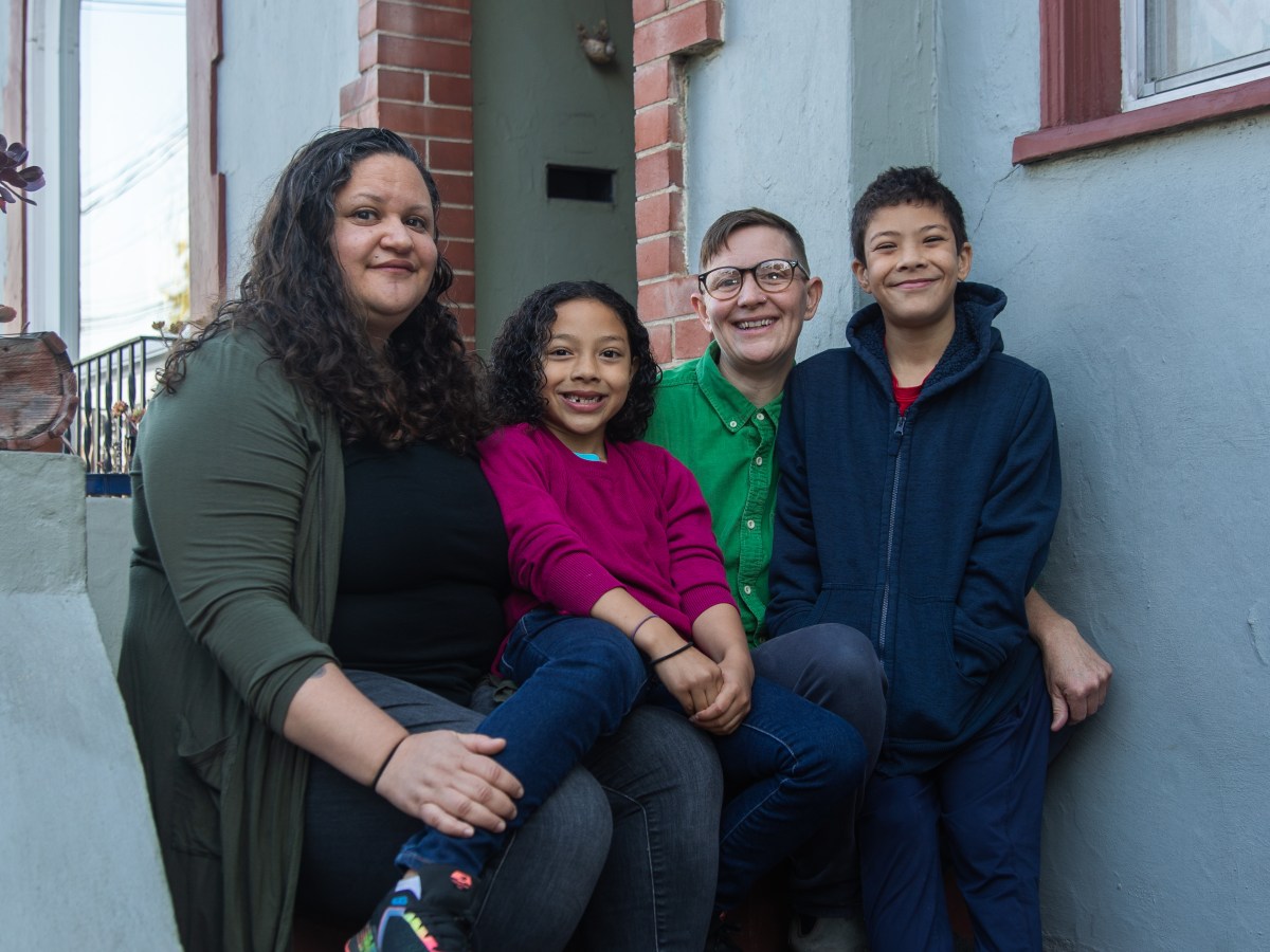Chela Delgado, her partner and their kids at their home before at-home school starts.