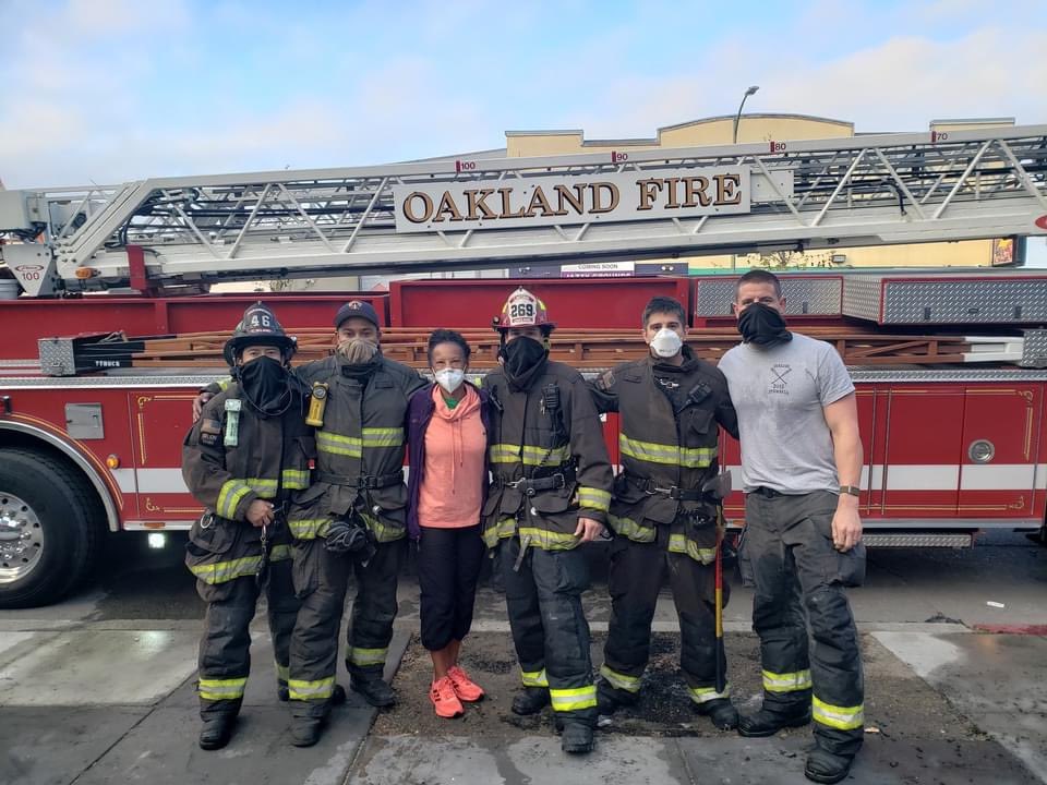 Regina Jackson with Oakland firefighters