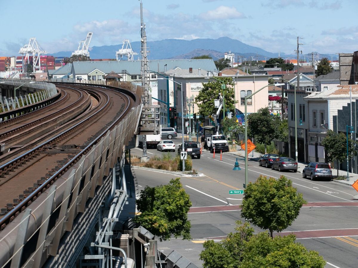 Photo taken on elevated train tracks, overlooking a neighborhood