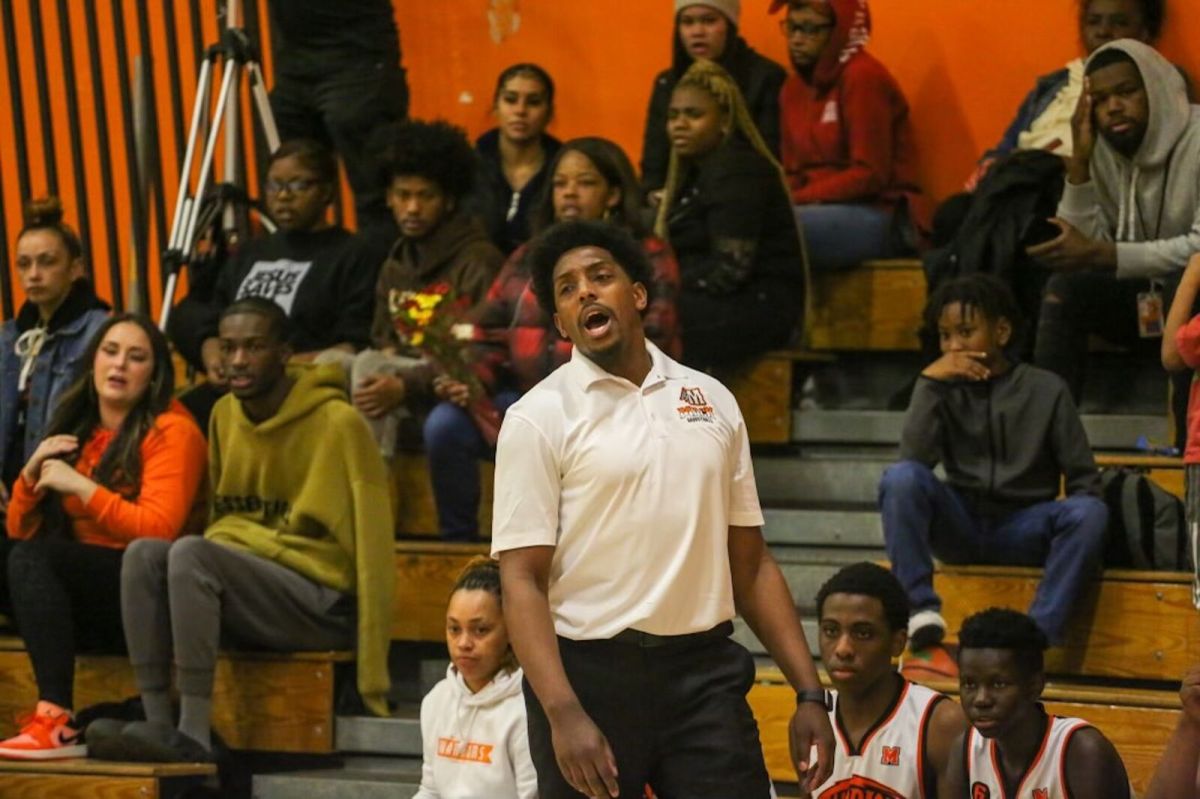 McClymonds High School basketball coach Barry Bell roams the sidelines during a game against Oakland High.