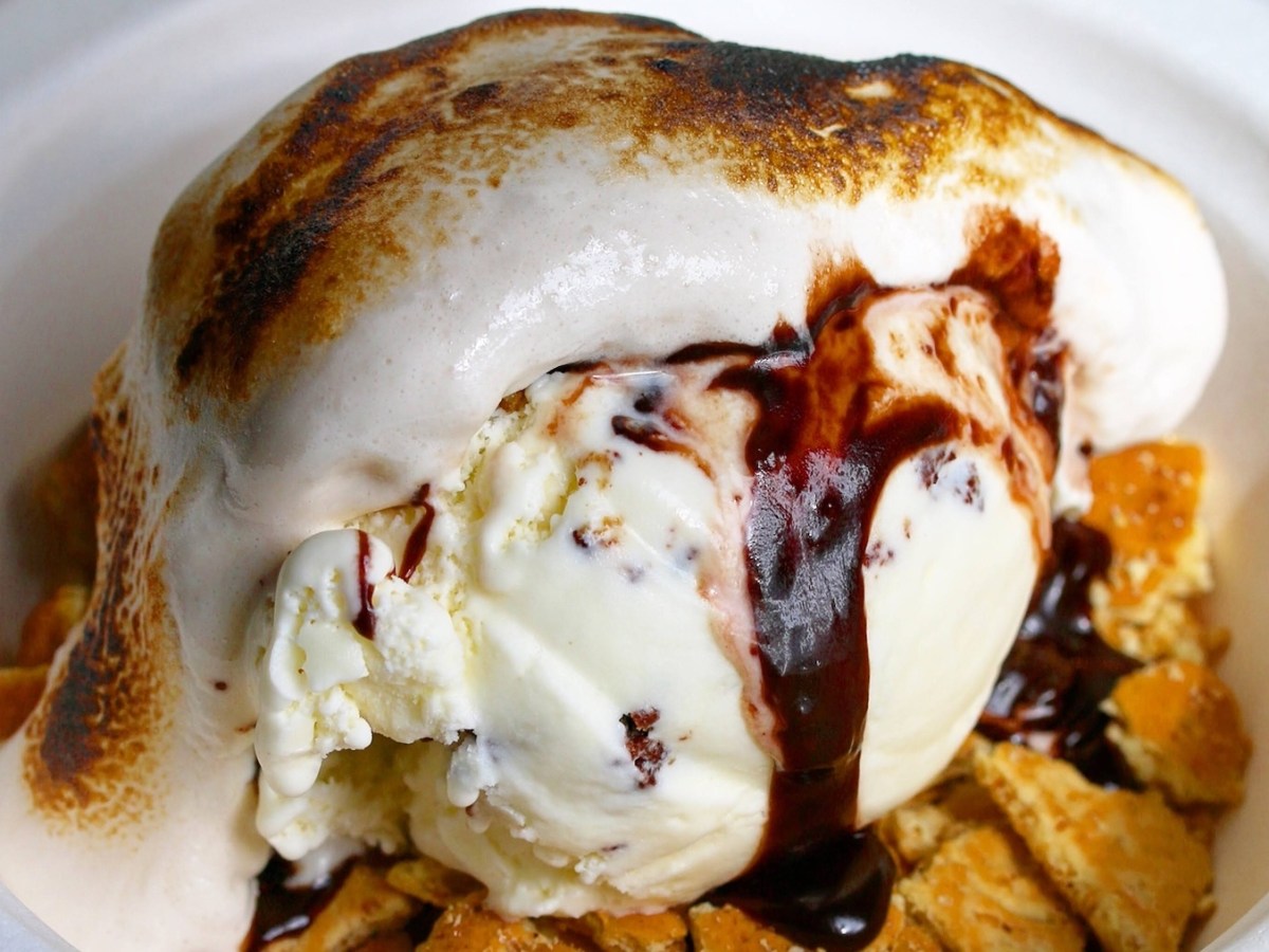 A s'mores sundae with ice cream, crushed graham crackers, toasted marshmallow and hot fudge