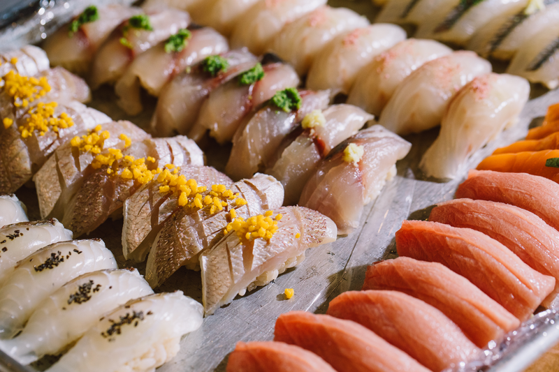 An assortment of sushi including hamachi and salmon from Sushi Salon.