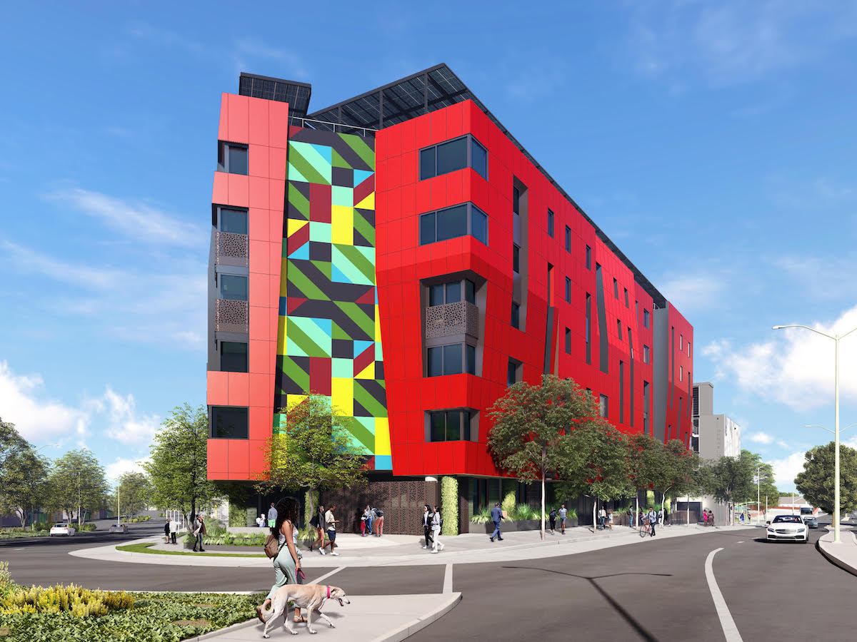Architectural rendering of a striking red apartment building at a city intersection, with one side decorated with a blocky, colorful design.