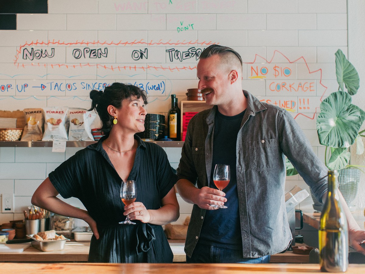 A portrait of Claire Sullivan and Devin Hohler at their Banter Wine Bar.